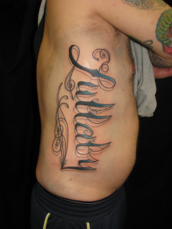  Traditional American Tattoos with tags cursive filigree lettering 